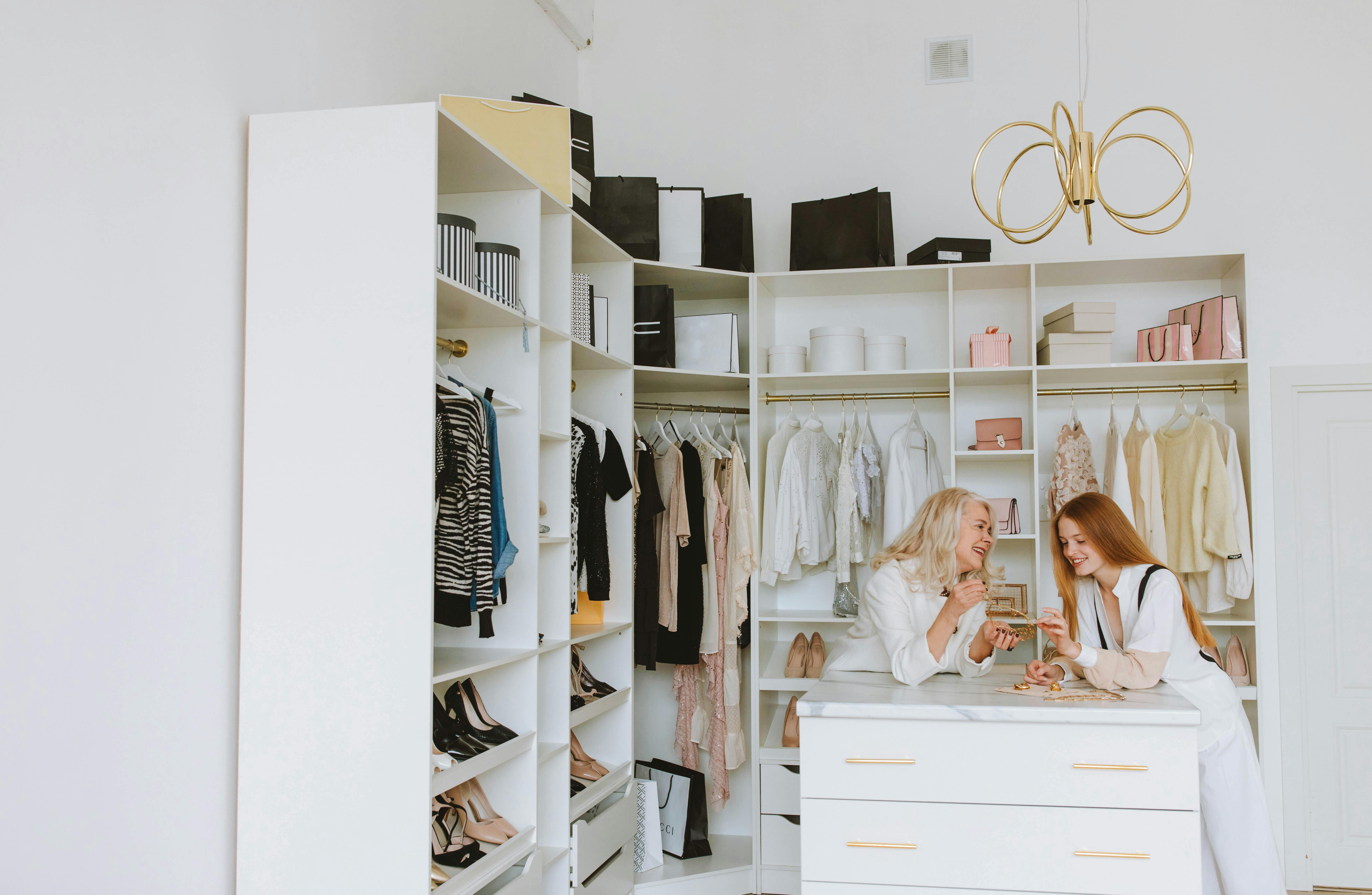 Vendor and user engaging in conversation about products, showcasing various items displayed on cabinets, emphasizing personalized shopping experience.